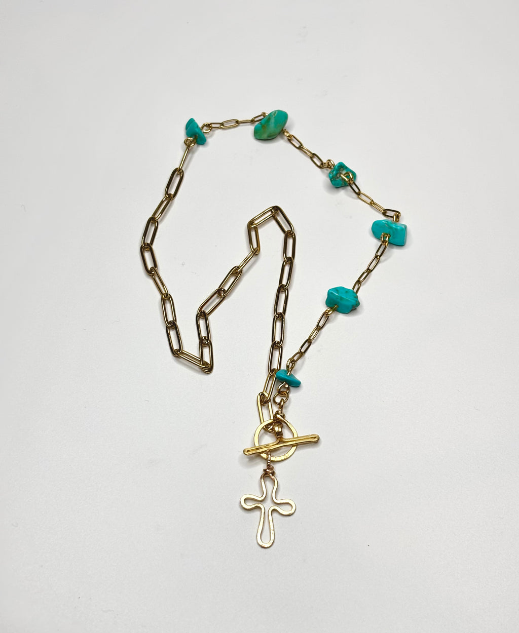 The turquoise cross necklace