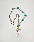 The turquoise cross necklace